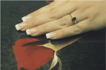 Photo Of Hand Featuring Finished Sculptured Nails